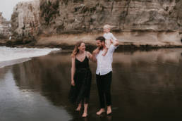 The Ferris Family walk on Maori Bay Beach on the West Coast of New Zealand