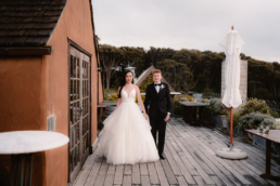 mud brick rooftop bride and groom